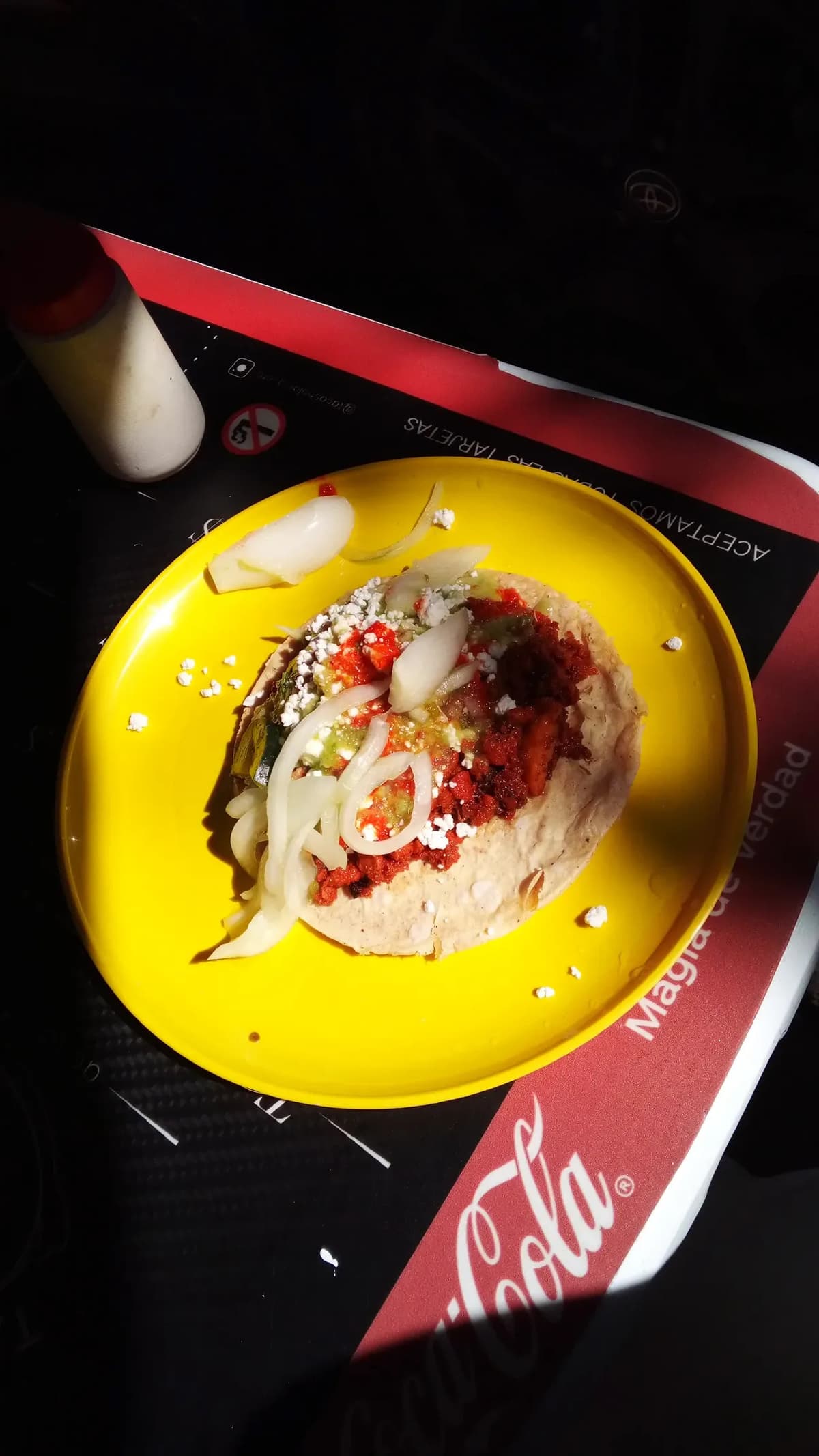 Taco on yellow plate in Mexico City